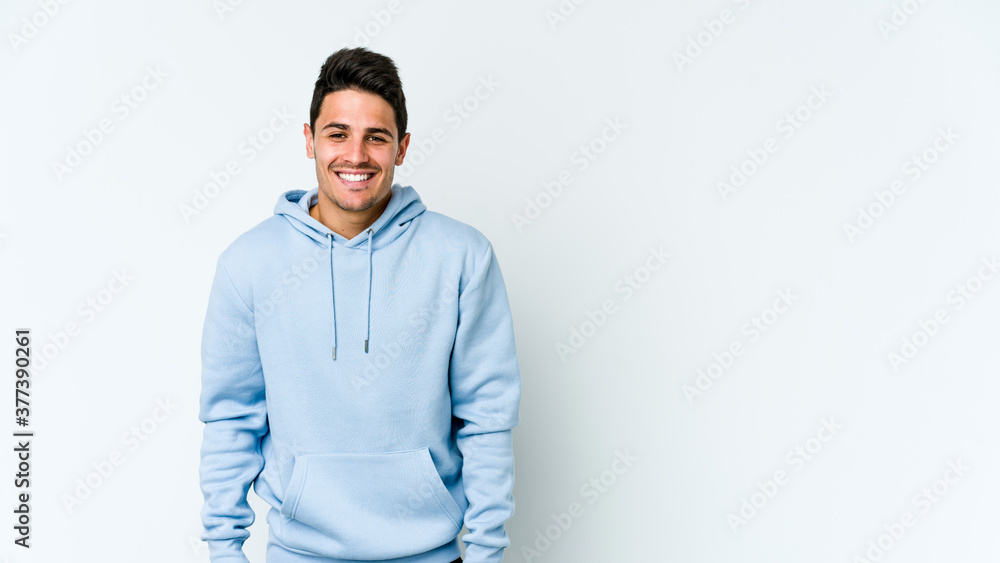 Young caucasian man isolated on white background laughs and closes eyes, feels relaxed and happy. Young caucasian man isolated on white background laughs and closes eyes, feels relaxed and happy.