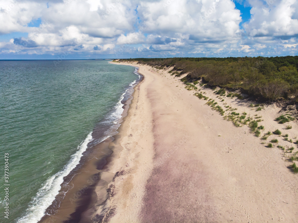 Beautiful aerial drone wide view of Curonian spit, Kurshskaya Kosa National Park, Curonian Lagoon and the Baltic Sea,  Kaliningrad Oblast, Russia and Klaipeda County, Lithuania, summer sunny day