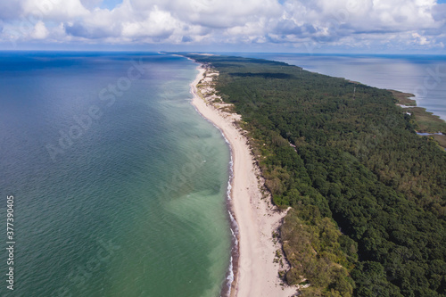 Beautiful aerial drone wide view of Curonian spit, Kurshskaya Kosa National Park, Curonian Lagoon and the Baltic Sea, Kaliningrad Oblast, Russia and Klaipeda County, Lithuania, summer sunny day