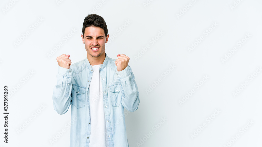 Young caucasian man isolated on white background showing fist to camera, aggressive facial expression. Young caucasian man isolated on white background showing fist to camera, aggressive facial expression.