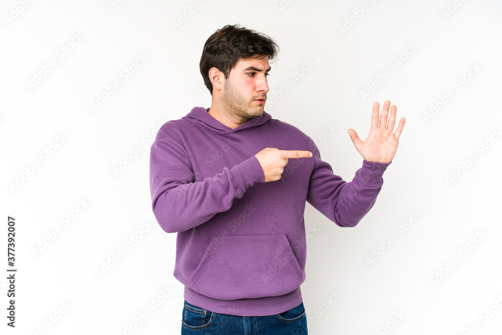Young man isolated on white background smiling cheerful showing number five with fingers. Young man isolated on white background smiling cheerful showing number five with fingers.