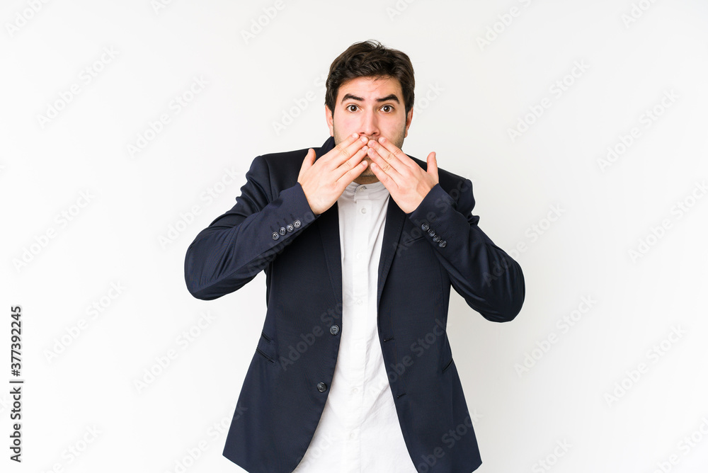 Young business man isolated on white background shocked covering mouth with hands. Young business man isolated on white background shocked covering mouth with hands.