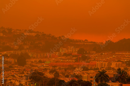 Orange haze over San Francisco on September 9 2020 from record wildfires in Californa, ash and smoke in the sky, daytime photo