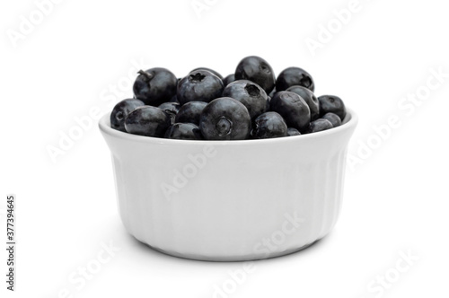 Bowl with blueberries on white.