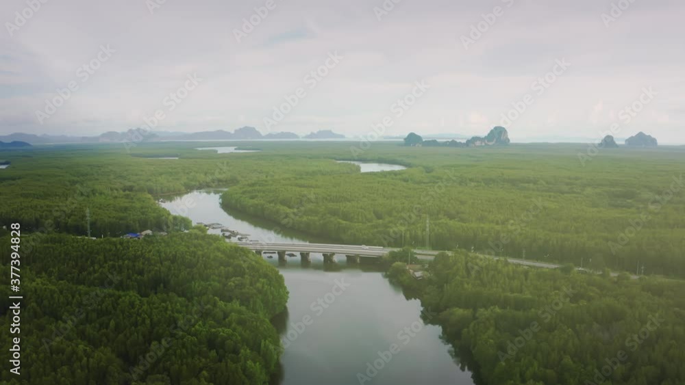 Drone shot. Nature surrounded the bridge and road with the samed nang chee view in the sunny day. Drone shot. Nature surrounded the bridge and road with the samed nang chee view in the sunny day.