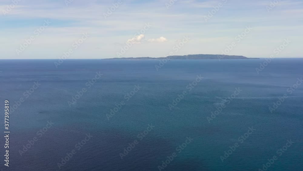 Seascape with blue sea and Sea against a blue sky with clouds. Limasawa Island, Southern Leyte, Philippines. Seascape with blue sea and Sea against a blue sky with clouds. Limasawa Island, Southern Leyte, Philippines.