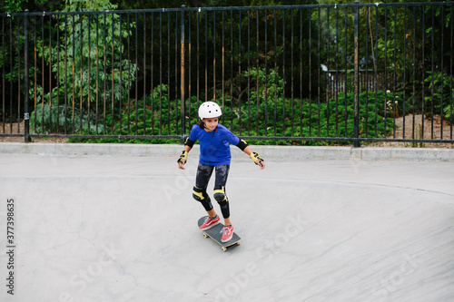 Wallpaper Mural Girl skateboards down a cement canyon at the skatepark Torontodigital.ca