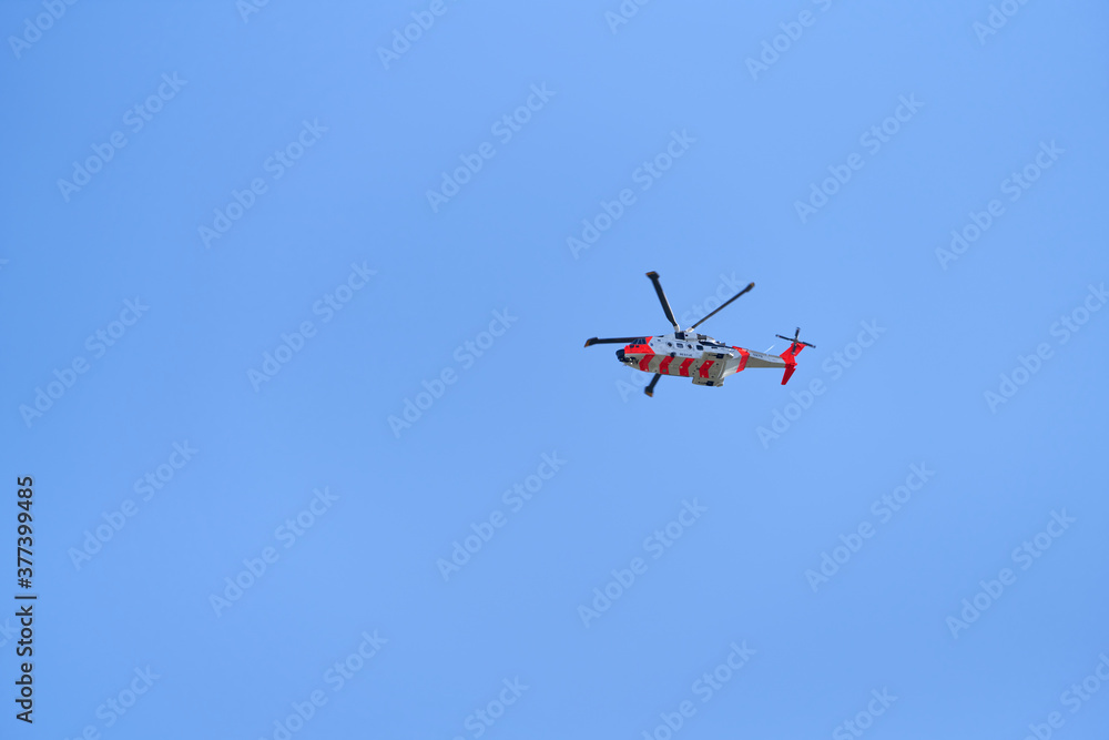 Rescue helicopter above Oslo's garden suburbs. The image has large copy space Rescue helicopter above Oslo's garden suburbs. The image has large copy space