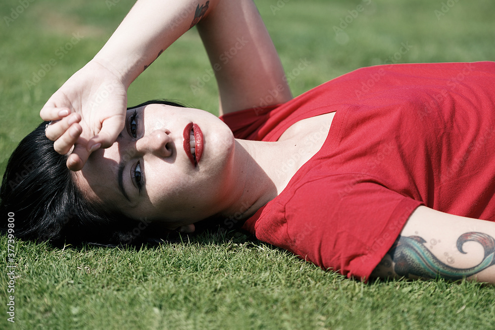 beautiful woman lying on the grass II beautiful woman lying on the grass II