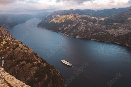 Top view of cruise ship cruising between the fjords in Norway photo