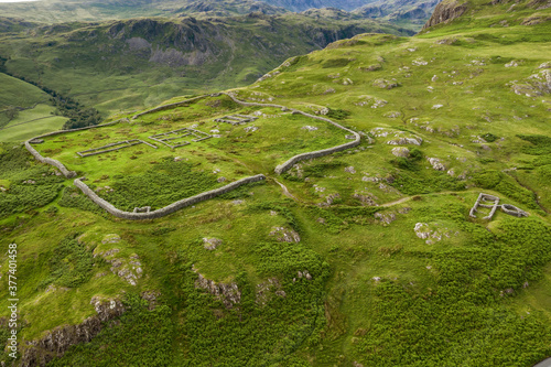 Aerial of Hardknott Roman Fort is an archeological site, the remains of the Roman fort Mediobogdum, located on the western side of the Hardknott Pass in the English county of Cumbria photo