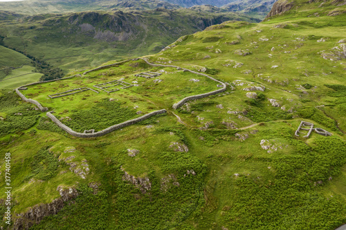 Aerial of Hardknott Roman Fort is an archeological site, the remains of the Roman fort Mediobogdum, located on the western side of the Hardknott Pass in the English county of Cumbria