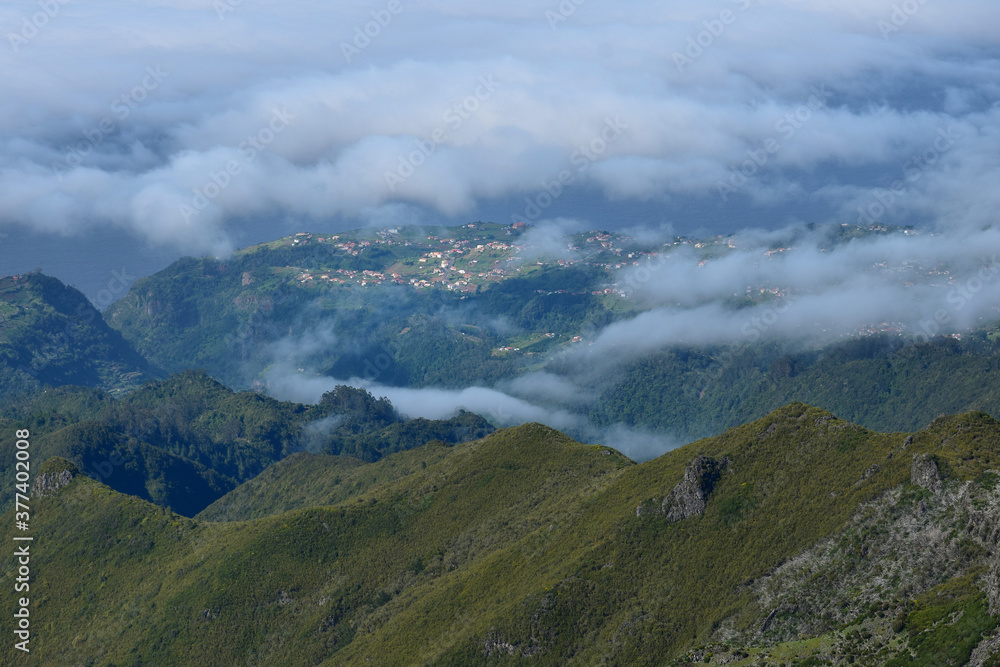 Madeiran landscape, view from a mountain to a small town. Madeira, Portugal.