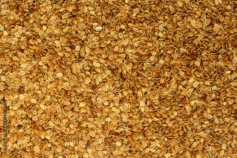 Roasted coriander seeds as background texture. Roasted coriander seeds as background texture.