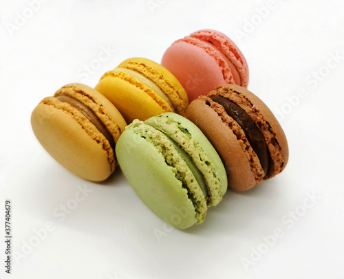 Five multicolored pastry macaron dessert isolated on white background