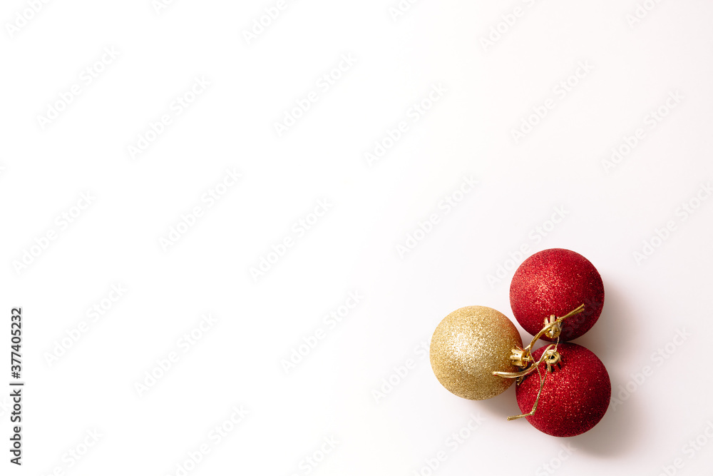 Christmas tree toys isolated on a white background. Three new year glitter balls red and gold color. Festive banner with place for text in fashion style.