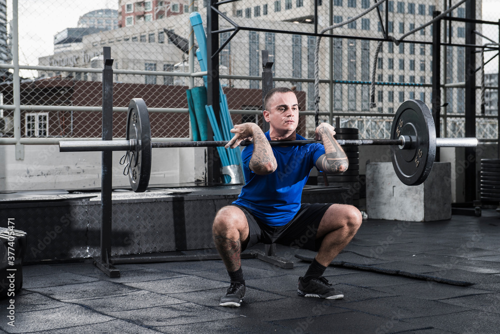 man training at rooftop gym in Bangkok man training at rooftop gym in Bangkok