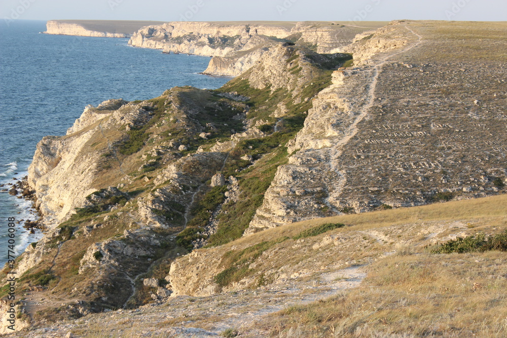 Dzhangul landslide coast. Stone inscriptions on the slopes Dzhangul landslide coast. Stone inscriptions on the slopes