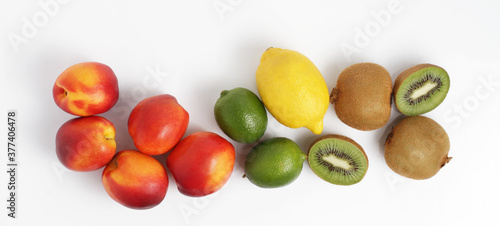 Fruit mix on a white background. Kiwi nectarine lemon lime. Top view