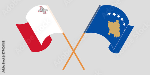 Crossed and waving flags of Kosovo and Malta