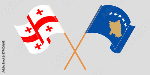 Crossed and waving flags of Kosovo and Georgia