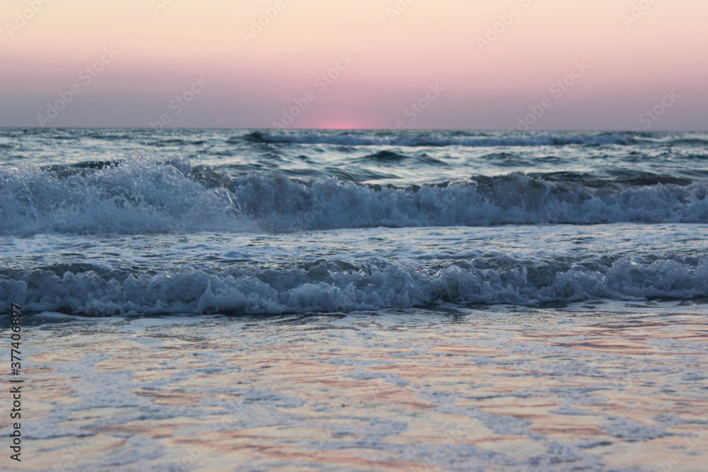 Mesmerizing sea surf at sunset. Olenevka