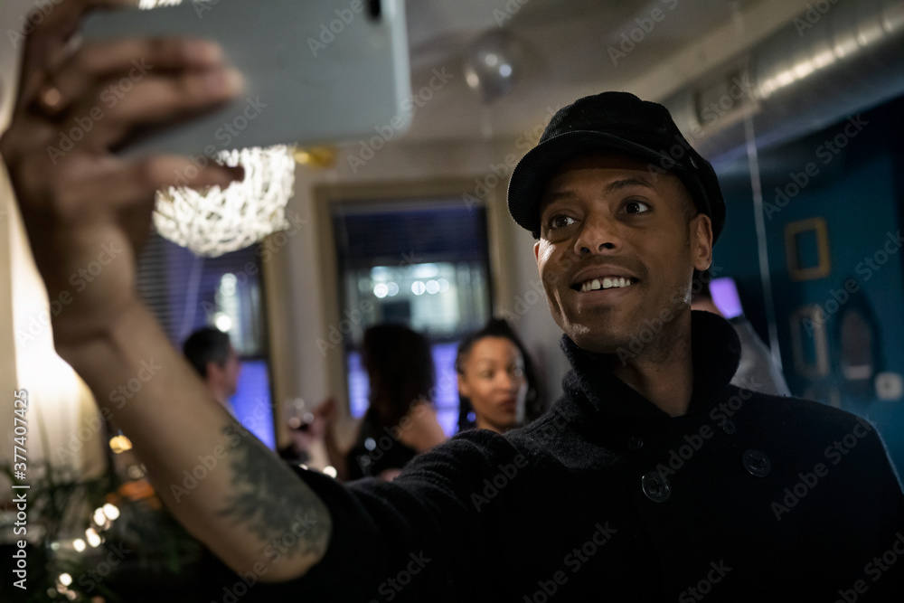 NYE: Hip Man Taking Selfie With Cell Phone