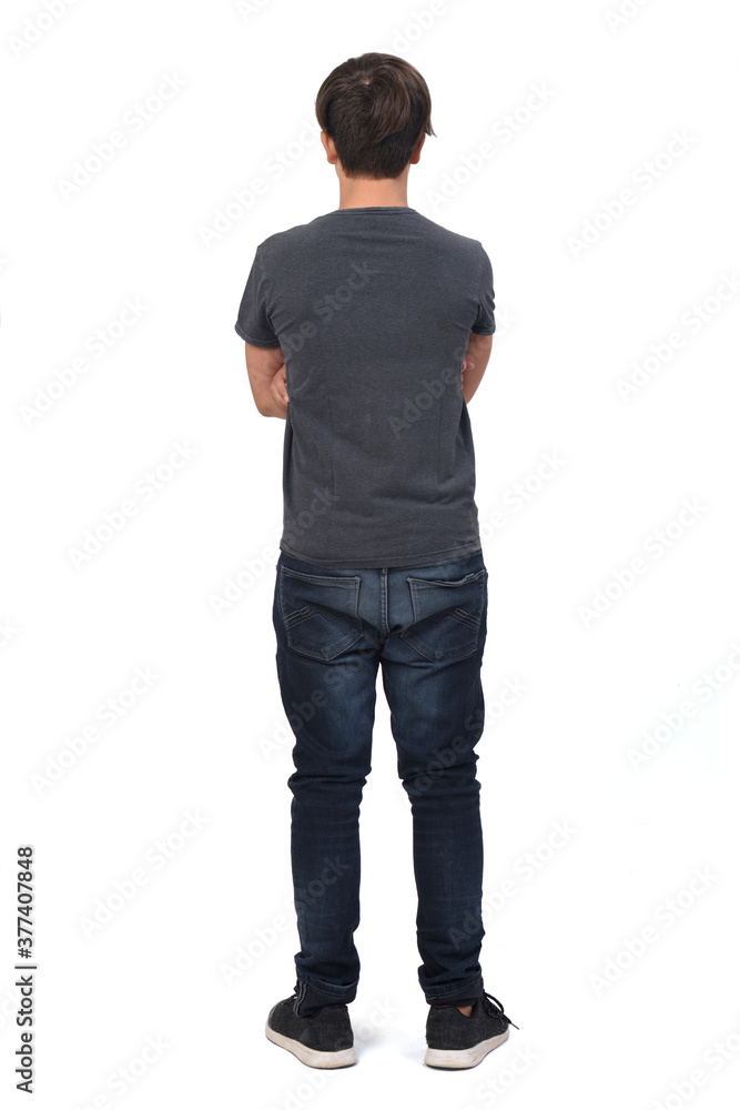 rear view of a teenage boy on white background, arms crossed rear view of a teenage boy on white background, arms crossed