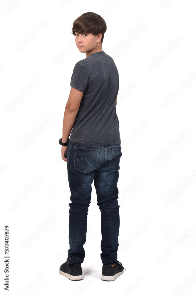 portrait of a teenage boy from behind looking at camera on white background portrait of a teenage boy from behind looking at camera on white background