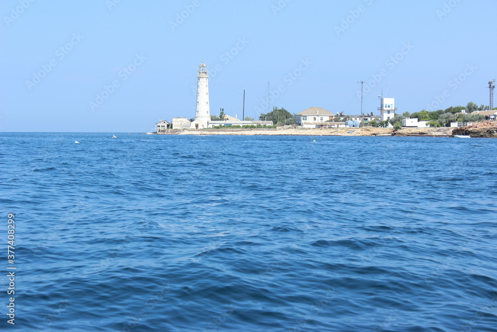 View of the ancient lighthouse of Cape Tarkhankut from the sea