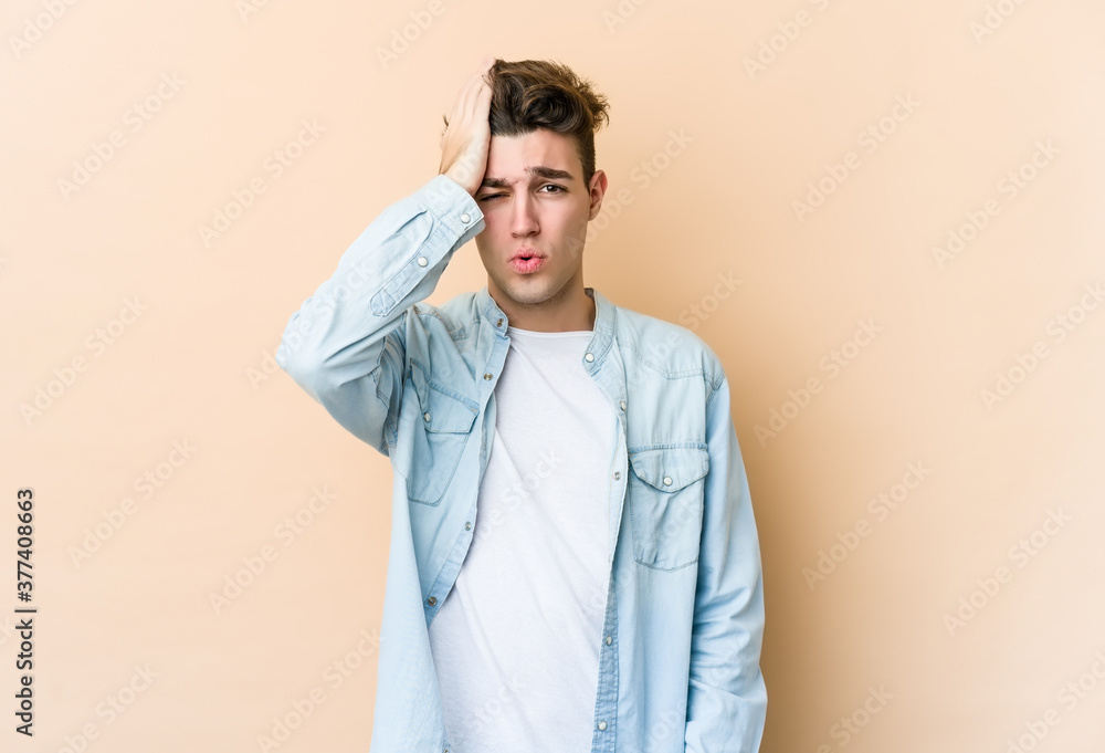 Young caucasian man isolated on beige background forgetting something, slapping forehead with palm and closing eyes. Young caucasian man isolated on beige background forgetting something, slapping forehead with palm and closing eyes.