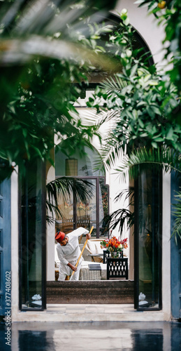 Moroccan Gardener Working in Riad photo