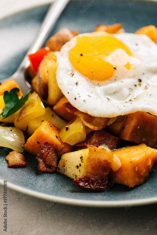 Sweet potato hash with bacon and fried egg Sweet potato hash with bacon and fried egg