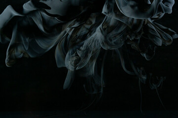 Abstract black clouds in water