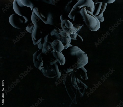 Abstract black clouds in water