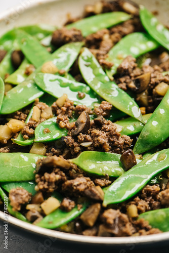 Asian inspired ground beef recipe in a white skilet photo