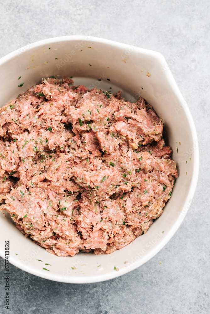 Freshly mixed meats and spices for a meatball recipe Freshly mixed meats and spices for a meatball recipe