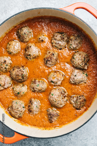 Meatballs added to fresh marinara sauce