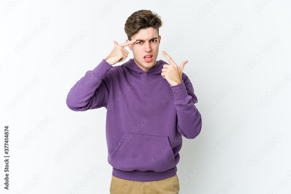 Young caucasian man isolated on white background showing a disappointment gesture with forefinger. Young caucasian man isolated on white background showing a disappointment gesture with forefinger.