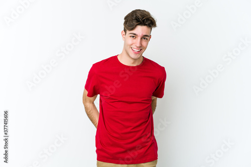 Young caucasian man isolated on white background happy, smiling and cheerful.