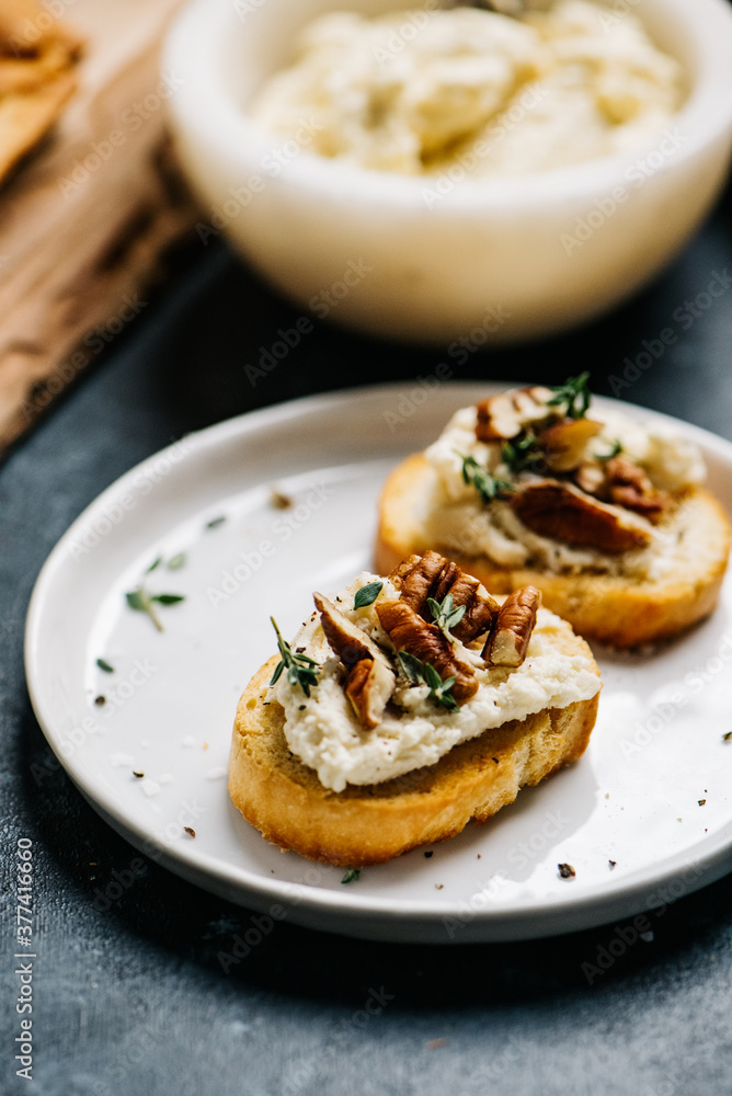 Crostini with honey whipped goat cheese and pecans Crostini with honey whipped goat cheese and pecans