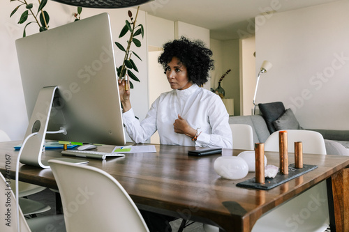 Telemedicine - Doctor Explaining How To Take Medicine photo