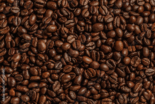 Roasted coffee beans brown and black background texture