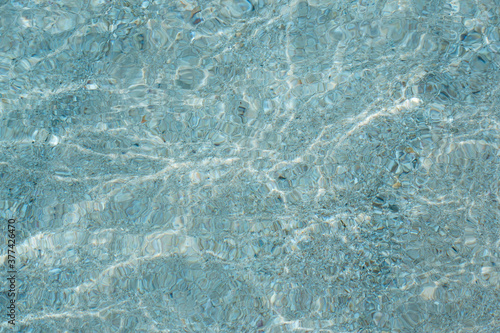 texture of sea water on the beach in summer, patterns and stains, background