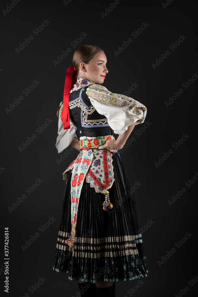 Beautiful woman wearing traditional Eastern Europe folk costumes. Slovak folk costumes.