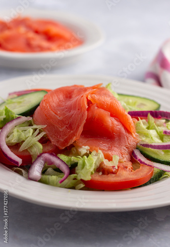 Smoked salmon with tomato and onion salad