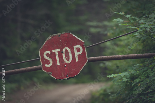 Canvas Print Close up of a stop sign on a gate in Algonquin Park Canada
