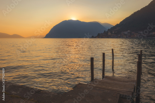 Wooden dock on Lake Iseo at sunset