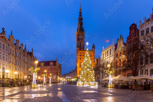 Christmas tree and illumination on Long Market Street and Town Hall at night in Old Town of Gdansk, Poland