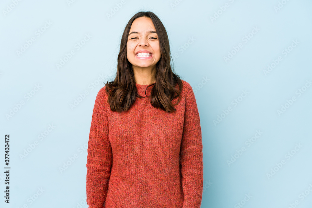 Young mixed race hispanic woman isolated laughs and closes eyes, feels relaxed and happy. Young mixed race hispanic woman isolated laughs and closes eyes, feels relaxed and happy.